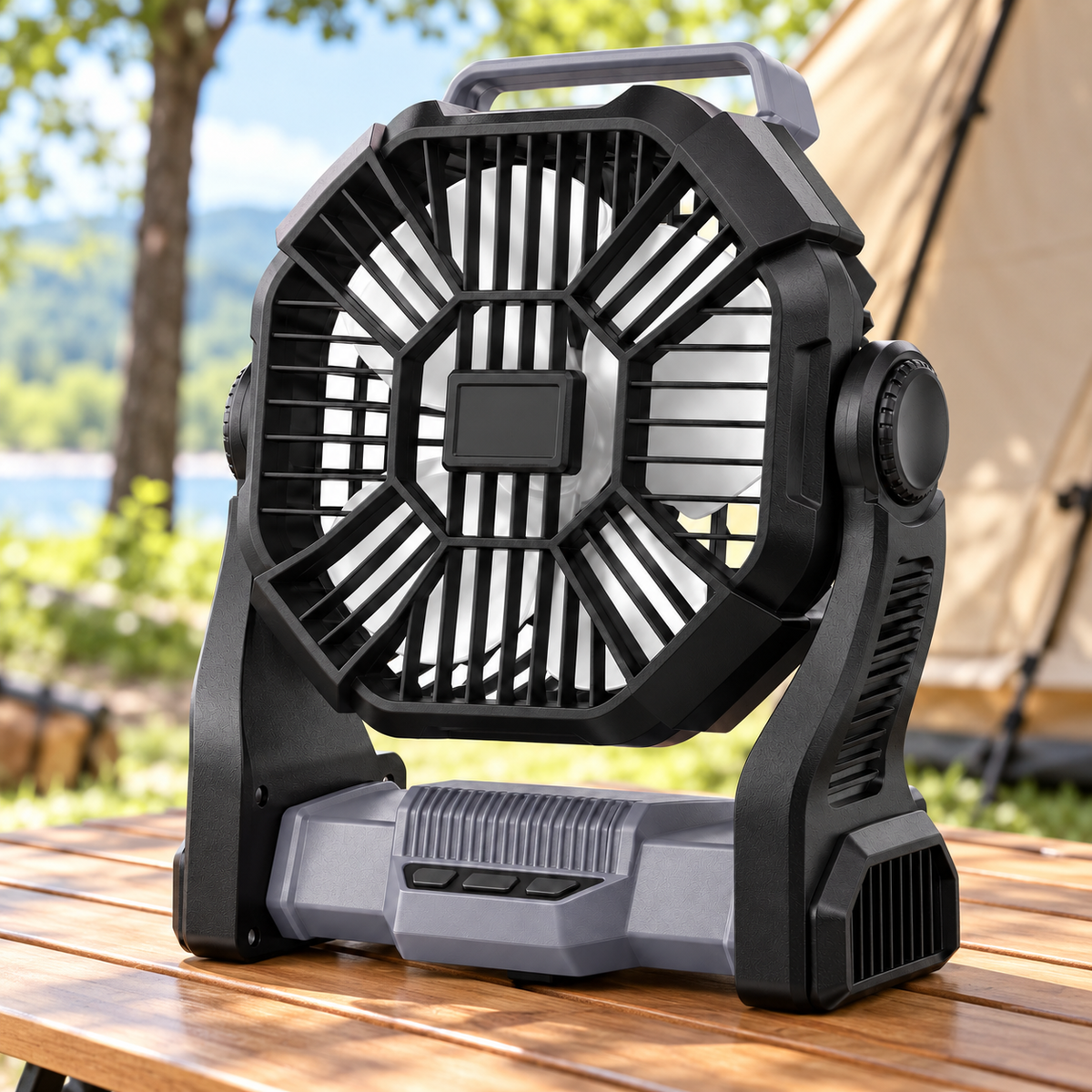 Gray and black portable camping fan on an outdoor table by a tent